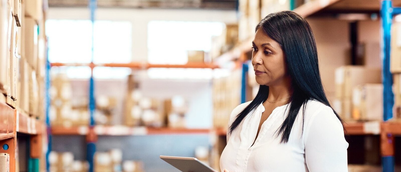 Indian warehouse supervisor and dispatch staff checking a distributor consignment before loading